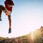 teenager-running-alone-at-the-mountain-with-sunset-man-jogging-positive-vibes-jumping.jpg